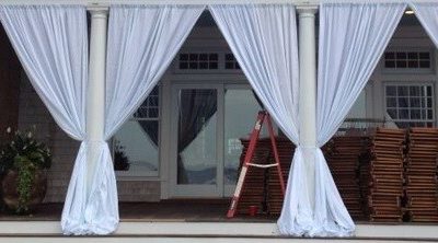 Patio Porch columns can be decorated  with white fabric curtains & bows.