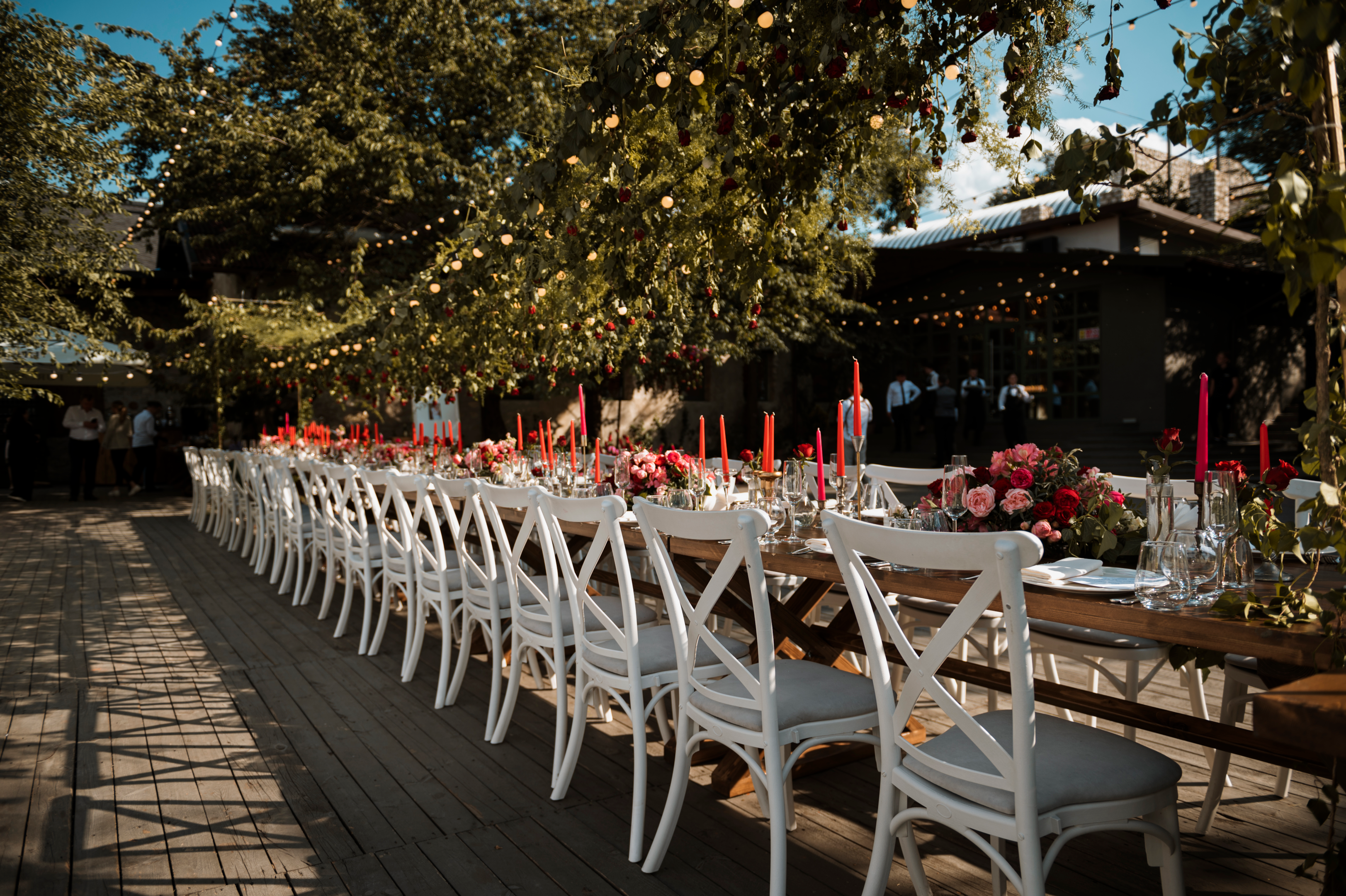 A table setting in an open area with trees around it for a party rental in Los Angeles.